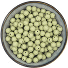 Ronde siliconen kralen van 12 mm in de kleur vergrijsd groen, met een zwarte spikkel