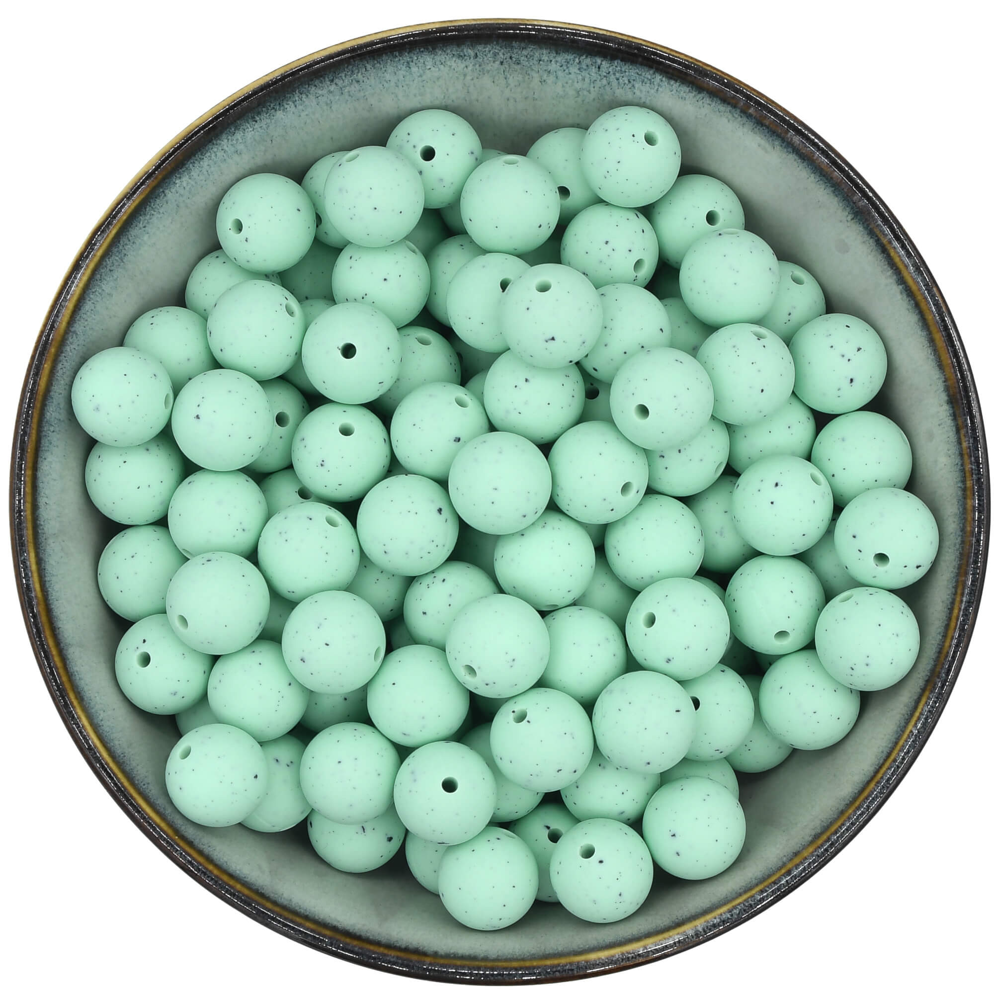 Ronde siliconen kraal van 15 mm in de kleur Mintgroen met zwarte spikkels