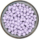 Ronde siliconen kraal van 12 mm in de kleur Poederlila met Spikkels