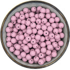 Ronde siliconen kraal van 12 mm in de kleur oudroze met spikkels