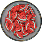 Siliconen figuurkraal in de vorm van een partje watermeloen met een gezichtje